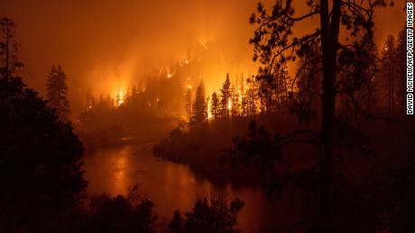 Two ultra-rare floods in a single week;  a forest fire generating its own weather.  Here's how it's connected