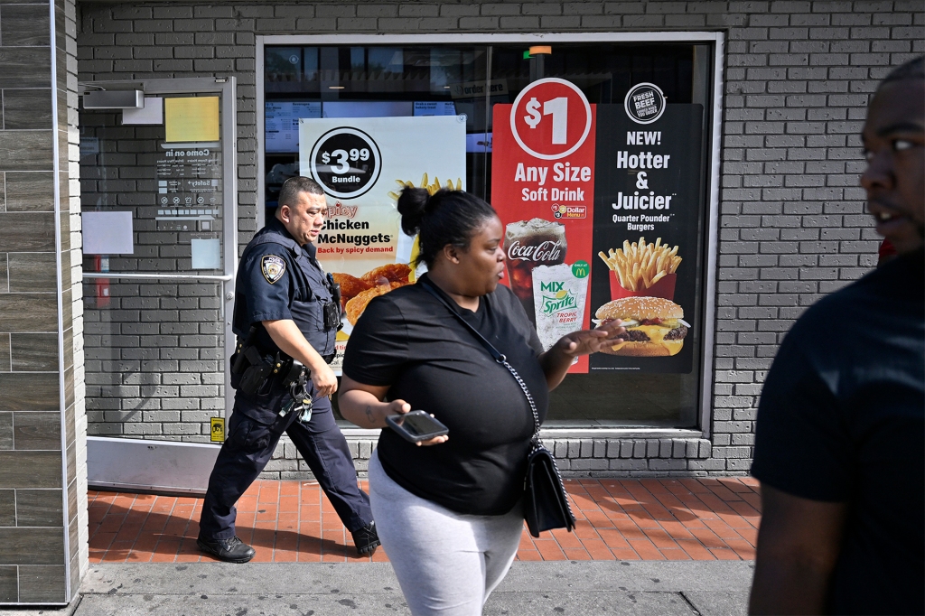 Officers are investigating the scene of the shooting at a McDonald's in Bed-Stuy, Brooklyn.