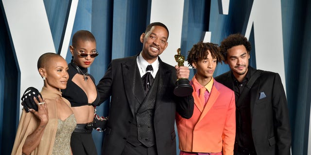 Will Smith, seen after winning the Best Actor Oscar and slapping Chris Rock.  He is pictured with his wife Jada and three children: Willow, Jayden and Trey (left to right).