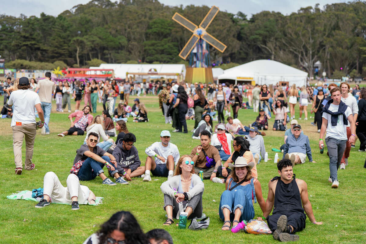 Fans sit on blankets near the new Windmill and watch Duckworth perform at Outside Lands in Golden Gate Park in San Francisco, Calif., Friday, Aug. 5, 2022.