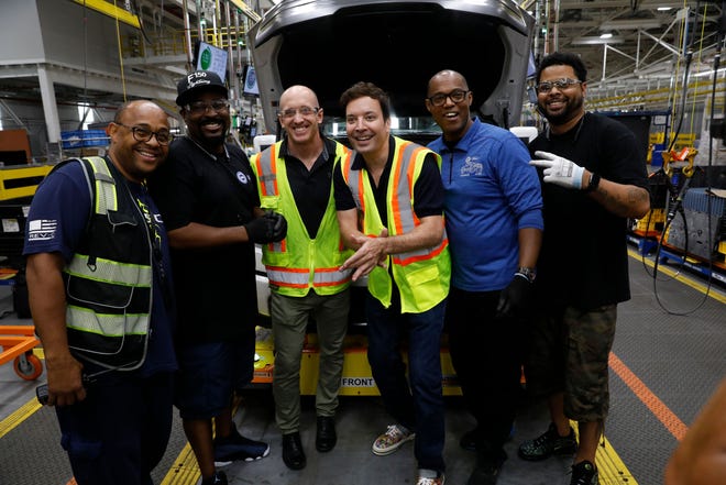 Jimmy Fallon posed with Ford employees Friday at a frunk installation station.