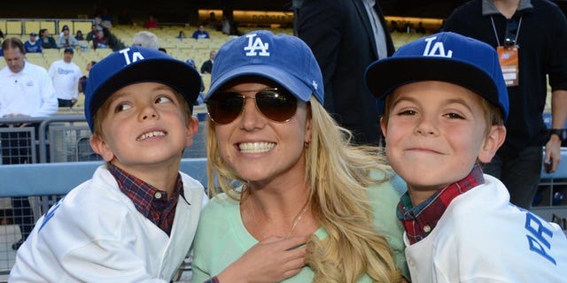 In this photo provided by the LA Dodgers, Britney Spears poses with her sons Jayden James Federline, left, and Sean Preston Federline, right, during a game against the San Diego Padres at Dodger Stadium on April 17, 2013 in Los Angeles , California. 