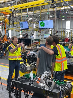 Ford CEO Jim Farley takes a picture of