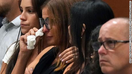 Patricia Oliver is comforted as a witness testifies to her son's fatal injuries during the penalty phase of the trial of high school shooter Marjory Stoneman Douglas at the Broward County Courthouse in Fort Lauderdale, Florida on August 1, 2022 .