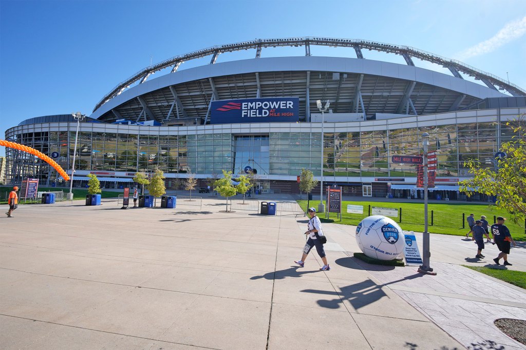 A woman has died after falling from an escalator after Kenny Chesney's concert at Empower Field at Mile High in Denver, Colorado.