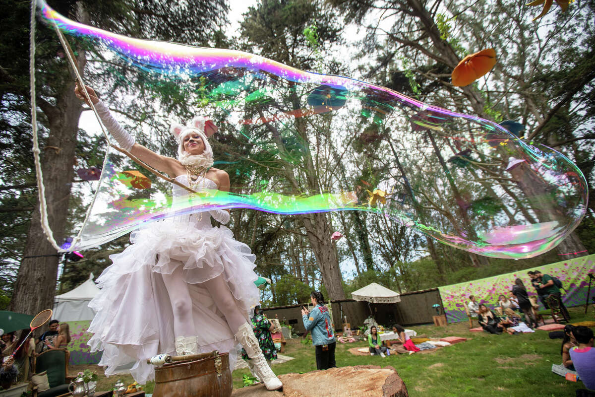 Erin Maxick blows an incredibly long bubble at Outside Lands in Golden Gate Park in San Francisco, California on August 5, 2022.